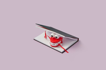 Open book with plastic toy jaws chewing bookmark.