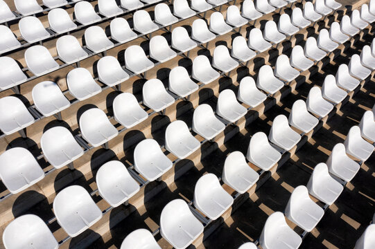 Empty white seats in a stadium
