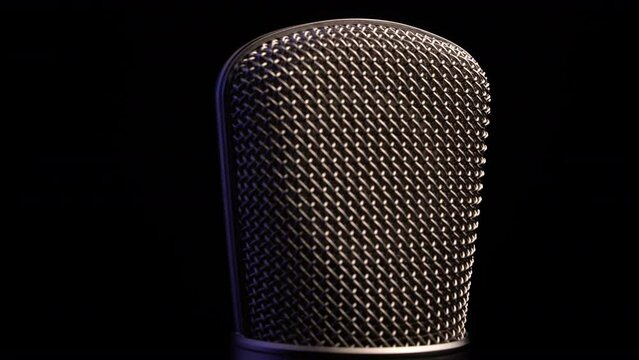 Professional Radio and Studio Microphone, Spinning on Black Background, Close Up