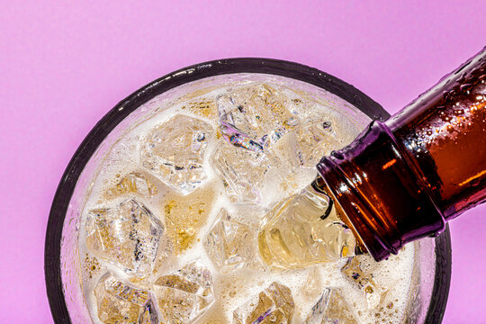 Pouring Beer into a Glass.