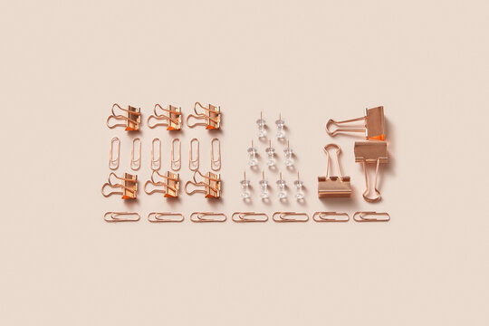 Trendy composition with bronze-colored stationery.
