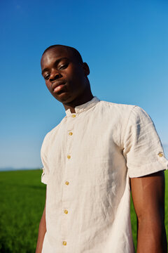 Portrait of black man against blue sky