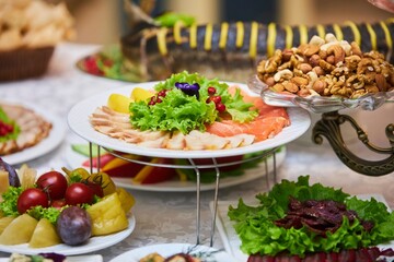 Fish slicing on the festive table. Photo of a set table, close-up