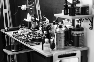 Barbers tools for mens haircuts laid out on a table - obrazy, fototapety, plakaty