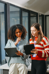 Female discussing new project with male colleague.