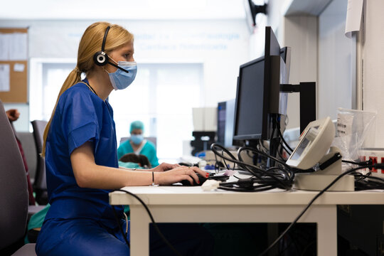 Female nurse studying x ray of patient