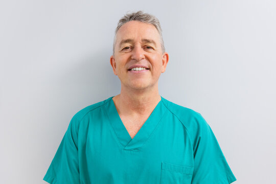 Portrait of confident male surgeon smiling at camera