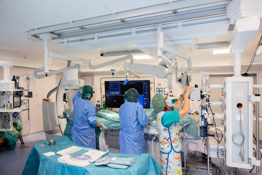 Group of doctors standing in hospital operating room