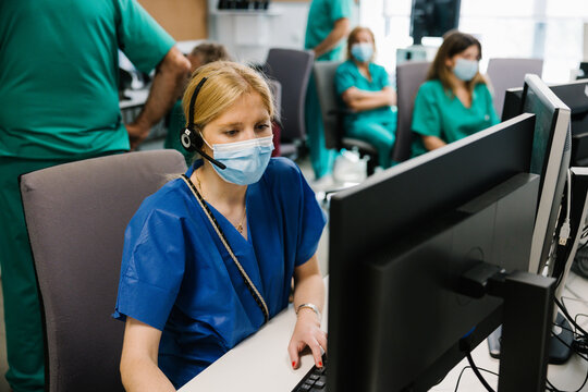 Female doctor working on computer in hospital