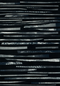 Strips of Mono printed paper on black