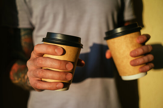 Man with two coffee cups
