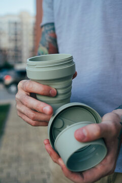 Man with reusable coffee cup