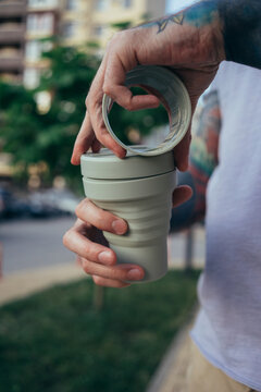 Reusable coffee cup in hands