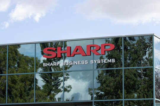Pleasanton, CA, USA - Feb 21, 2024: Sharp logo is seen at the Sharp Business Systems (SBS) Pleasanton office in California. SBS is a direct sales division of Sharp Electronics Corporation.