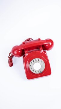 red vintage telephone in vertical