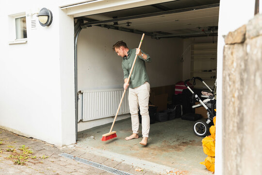 Man cleaning in garage