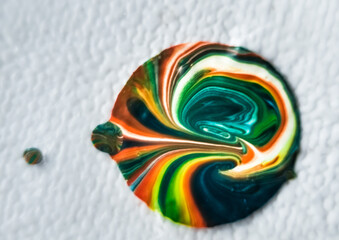 Abstract background of multicolored acrylic paint in the form of a flower