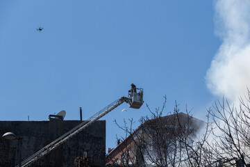 Firefighter on a high crane.
