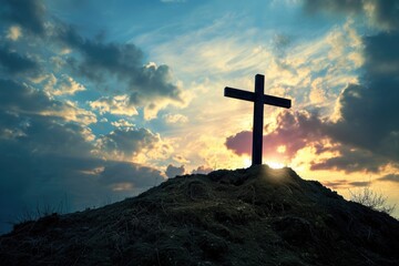 Wooden cross on a hill with dramatic sunset sky. - obrazy, fototapety, plakaty