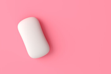 White soap bar on pink background with copy space.