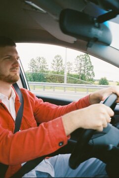 Driver in a red jean jacket