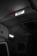 exit sign in airplane interior