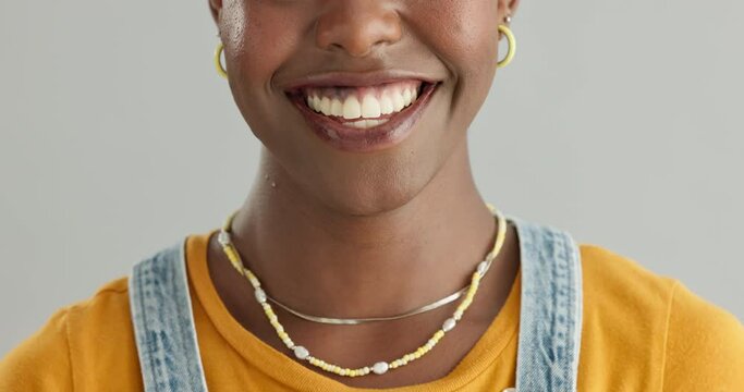 Black woman, face and teeth for dental and health in studio, happy with smile and oral hygiene on grey background. Mouth, orthodontics and positive model for fresh breathe, veneers and whitening