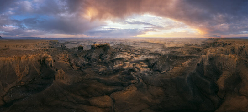 Sunrise from a viewpoint overlooking the desert with badlands