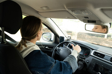 Checking Mirrors Before Driving Away
