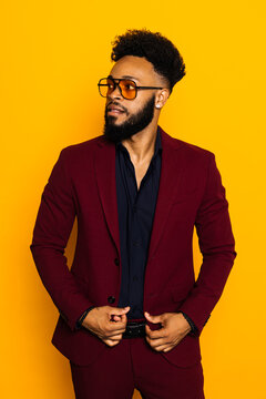 Confident black man in trendy elegant outfit