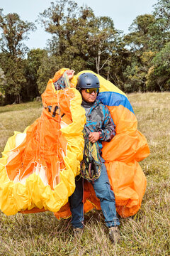 Man holding a parachute