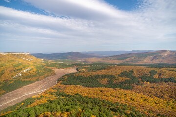 Naklejka premium The autumn landscape of the mountain valley is an amazing, beautiful place at any time of the year. Hiking. Nature