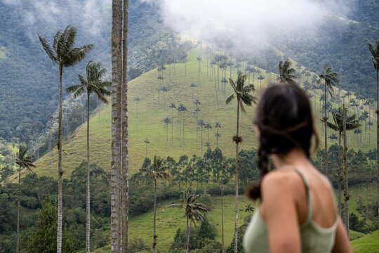 Blurred Tourist Woman Trekking In Mountains