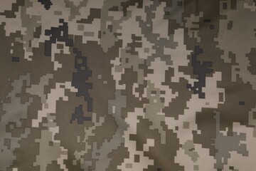 Texture of camouflage fabric as background, top view