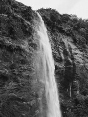 Black and white view from below beautiful cascading waterfall