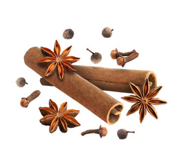Cinnamon sticks and other aromatic spices falling on white background