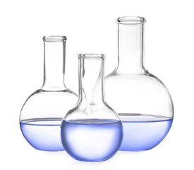 Boiling flasks with blue liquid isolated on white. Laboratory glassware