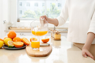 Pour freshly squeezed orange juice