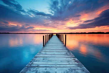 Fototapeten Blue Lake at Sunset: Wooden Piers Reflecting on the Serene Waters with Stunning Horizon Design © Serhii