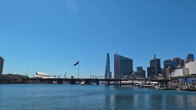 Bright sunny day at Darling Harbour with clear skies and city skyline, featuring Barangaroo point
