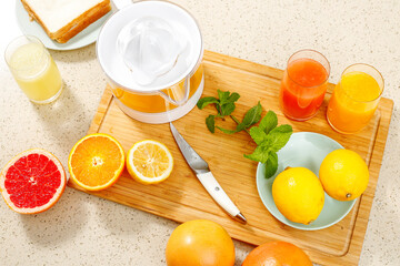 Making fresh squeezed orange juice in the kitchen