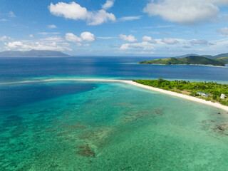 Clear turquoise water in white sand beach in Bon Bon Beach. Romblon Island. Romblon, Philippines.