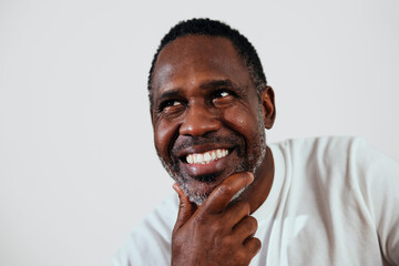 Studio portrait of happy mature man smiling 