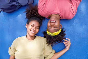 Carefree lovers lying on the sports court