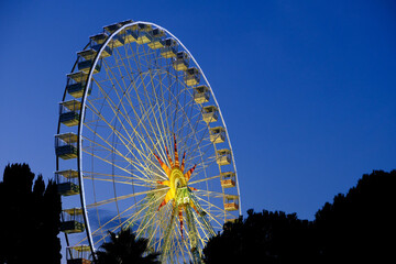 Night view of a Ferris Wheel in Nice, France