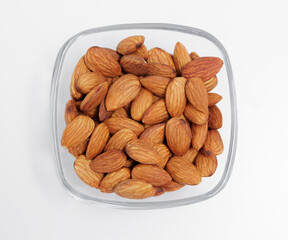 bowl of almond nuts on white background