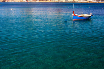 Fototapeta premium Saint Julian Bay with traditional colourful fishing Boats Luzzu, Malta