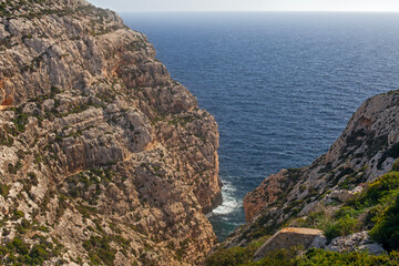 Beautiful rocks in the ocean and view of the famous Blue Grotto, Malta