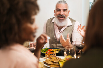 Engaging Man Telling Stories at Dinner Party