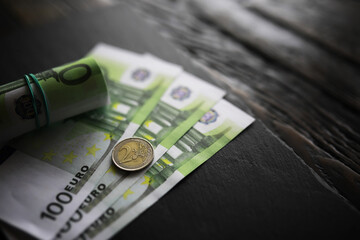 100 euro banknote pack and wood bankground. Currency, financial